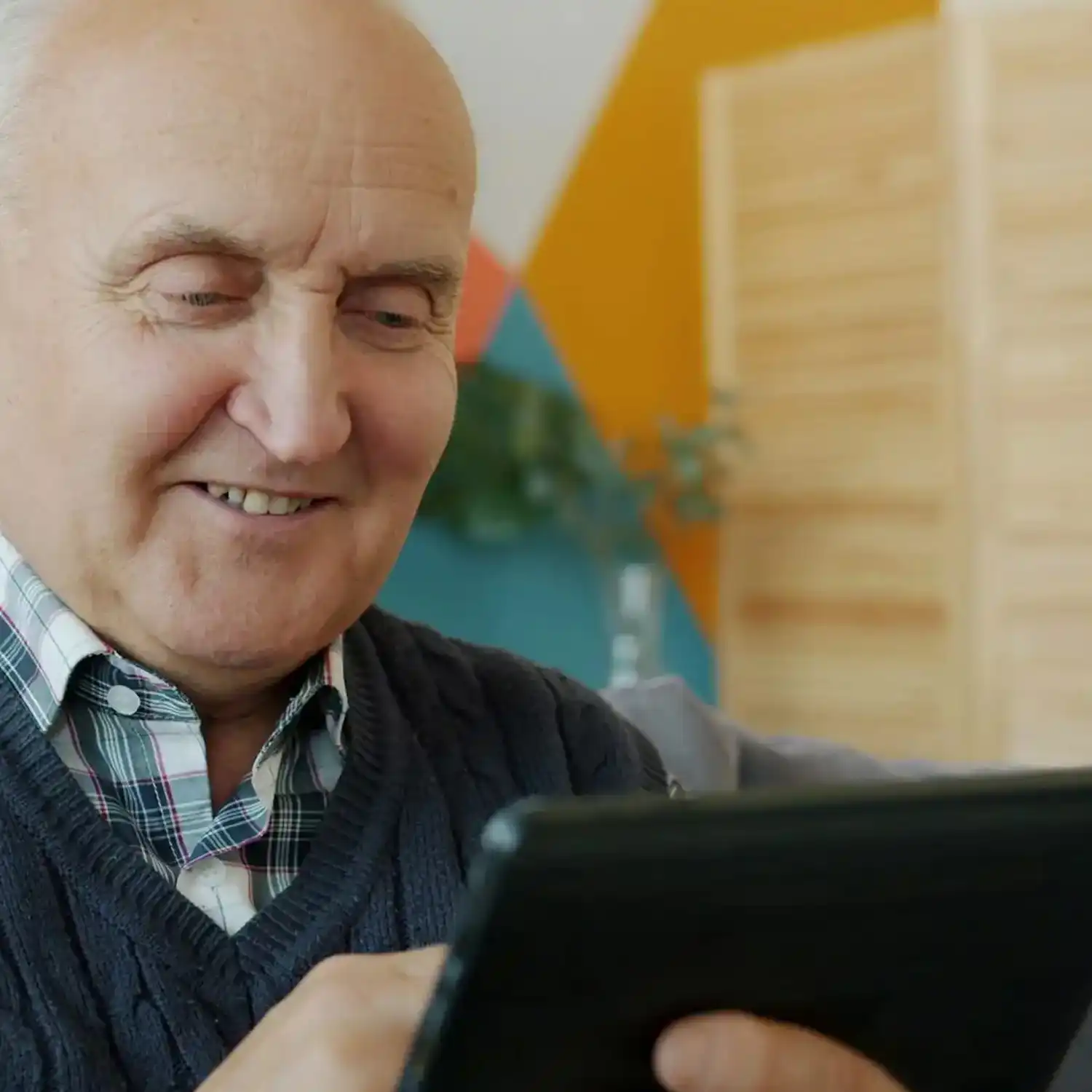 senior man using tablet